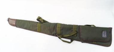 A green gun case with pocket