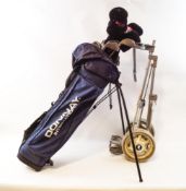 A golfing bag containing a quantity of irons and woods,
