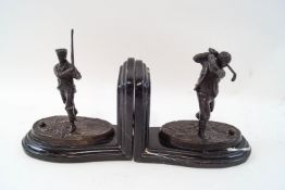 A pair of modern bronzed bookends, modelled as Victorian golfers, signed REECE '09,