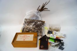 A box of fly fishing equipment and materials
