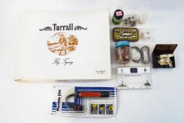 A collection of assorted fly's and fly tying materials