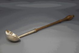 A George II silver punch ladle, makers mark GD in script, London 1740,