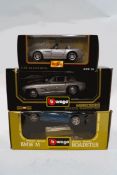 A Burago Mercedes Benz 300SL Roadster 1957 and a BMW M, boxed; together with a Maisto BMW Z8,