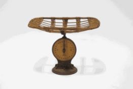 A Salters infant weighing machine with basket weave top,
