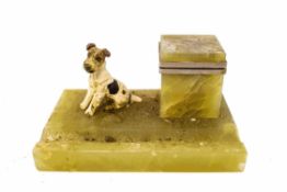 An Art Deco onyx desk stand with a cold painted bronze figure of a seated terrier,