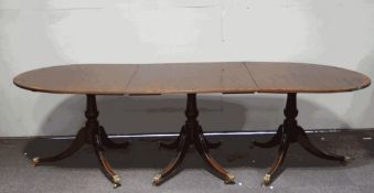 A Regency style mahogany triple pedestal dining room table, with two additional leaves,