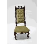 A Victorian rosewood pre dieu chair, with carved cresting rail between barley twist supports,