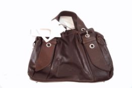 A Radley bag with its outer bag and a Tula bag,