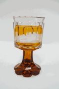 A Victorian Bohemian amber flash glass with flared foot, engraved with a scene of 'Coln', 15.