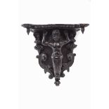 A carved oak and lime wood wall bracket, possibly from a ship,