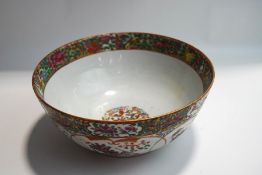 A Canton enamel bowl, with typical decoration of birds and butterflies among peonies, 26.