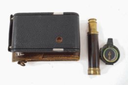 A Victorian three drawer pocket telescope by Dolland of London, a WWI field compass,