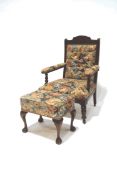 A Victorian button back salon armchair, upholstered in floral chinz,