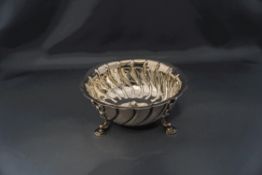 A silver bowl, by Messrs Barnard, London 1903, with fluted decoration and a cut rim,