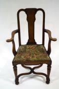 An 18th century style walnut chair with parcel gilt legs, joined by a wavy X frame stretcher,