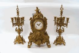 An Italian clock garniture, consisting of an eight day clock in the Rococo style,