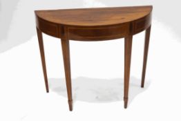 A George III mahogany side table of demi lune form on square tapering legs, 71.