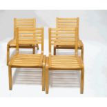 A set of four beech stacking chairs with bent wood frames,