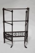 A Victorian folding towel/clothes rail with fretwork lower panels and front pad feet,