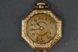 A lady's fob watch, the octagonal case with a circular gilt dial,