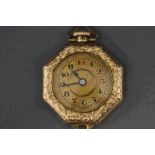 A lady's fob watch, the octagonal case with a circular gilt dial,