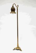 A Victorian style brass standard lamp, with hanging glass shade,