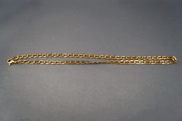 A 9 carat gold chain, of filed curb type links, 40.