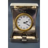 A silver hallmarked travel clock, Birmingham 1928, the movement,