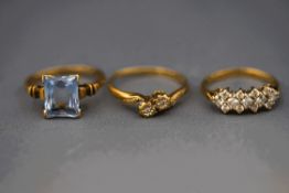 A 9 carat gold two stone single cut diamond cross over ring;