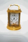A Continental small brass carriage clock, with porcelain panels, 11.