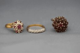 Two cluster rings and a 9 carat gold seven stone ring, 9.