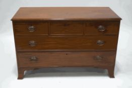 A 19th century mahogany chest of drawers, three short over two long, height reduced,
