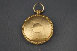 A Victorian gold vinaigrette pendant, unmarked, circular with engine turned decoration, 2.