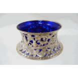 An Edwardian Irish silver potato ring with blue glass liner, by Wakeley & Wheeler, Dublin 1908,