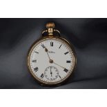A 9 carat gold Waltham open faced pocket watch, the white enamel dial with black Roman numerals,
