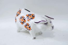 A 1960's pottery money box, by Arthur Wood, painted in enamels, with printed factory marks,