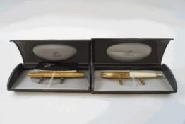A Parker fountain pen, with textured gold tone body and 14K gold nib, and a Parker ballpoint pen,