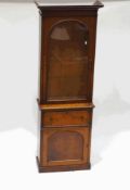A Victorian mahogany glazed bookcase, with four shelves, above a single drawer and cupboard,