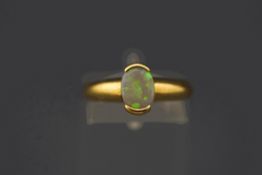 An opal ring, stamped '18k' and '750', finger size N1/2, 3.