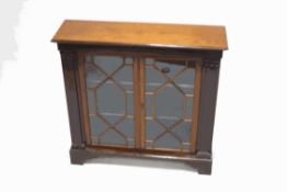A 19th century and later mahogany bookcase with two astragal glazed doors,