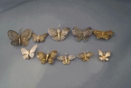 A collection of ten butterfly brooches, in various metals,