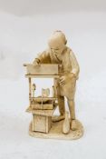 An early 20th century Japanese carved ivory figure of a craftsman, signature to base, 14.