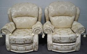 A pair of modern cream armchairs,