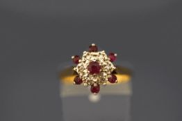 An 18 carat gold ruby and single cut diamond cluster ring, finger size O, 3.