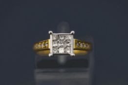A diamond cluster ring, stamped '18K',