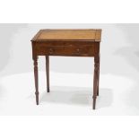 A late Victorian oak desk with fall front and single drawer