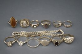 A collection of silver and silver coloured jewellery, comprising; nine rings,