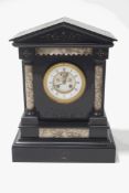A Victorian black marble mantel clock of architectural form, the enamel dial with Roman numerals,