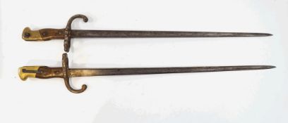 Two French Bayonets, both of the same pattern, with the top of the blade inscribed, 64.