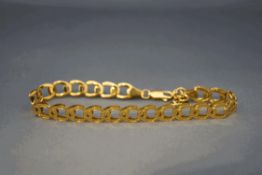 A 9 carat gold bracelet, of horse shoe shaped links, 4.